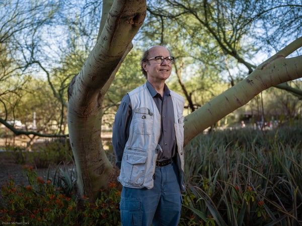 Frank Wilczek standing under a tree.