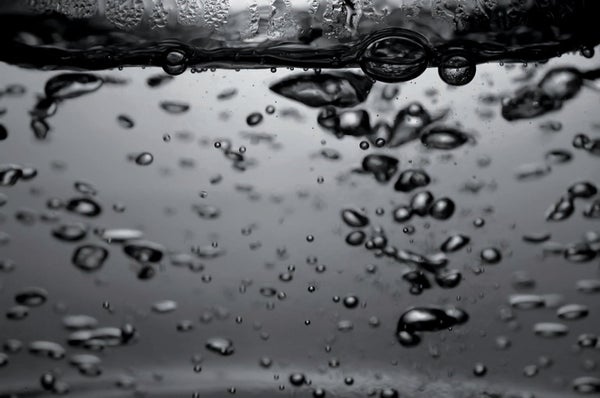 Close-up image of water with bubbles.