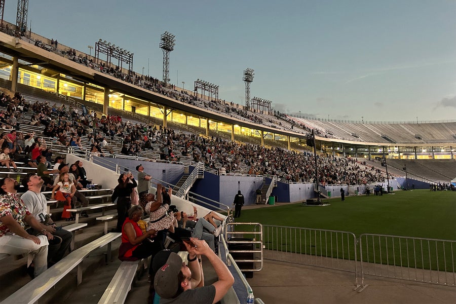 People watching the eclipse at a stadium